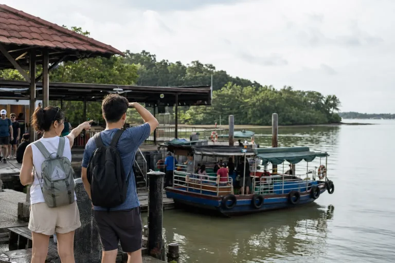 Travelers choosing a bumboat day trip from Singapore