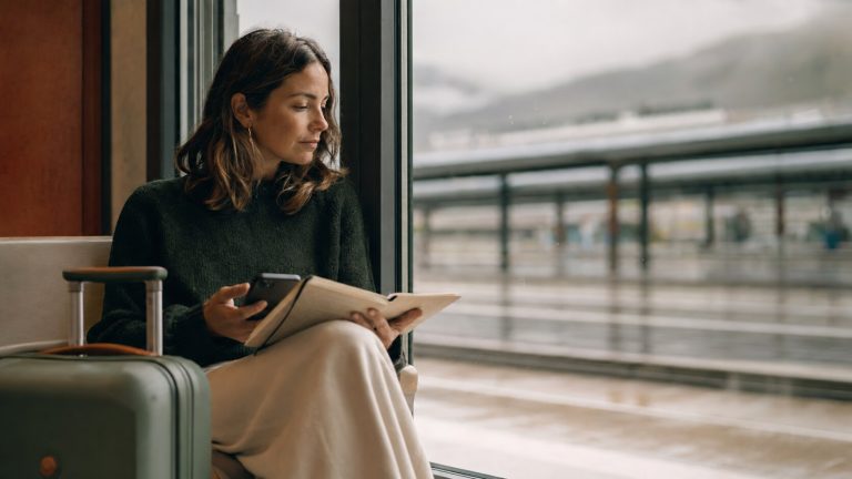 Traveler calmly replanning a disrupted journey as an example of emotional resilience