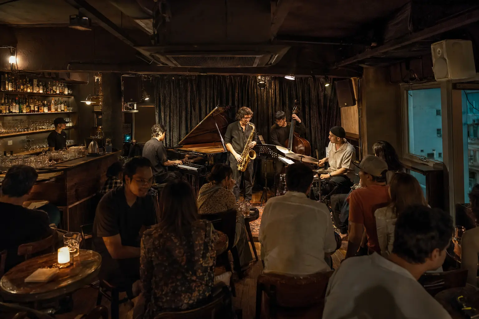 Audience listening to a jazz band in a compact Wan Chai live music bar