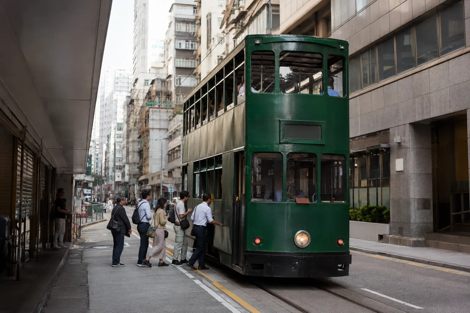 Passengers boarding a double-decker tram on Hong Kong Island