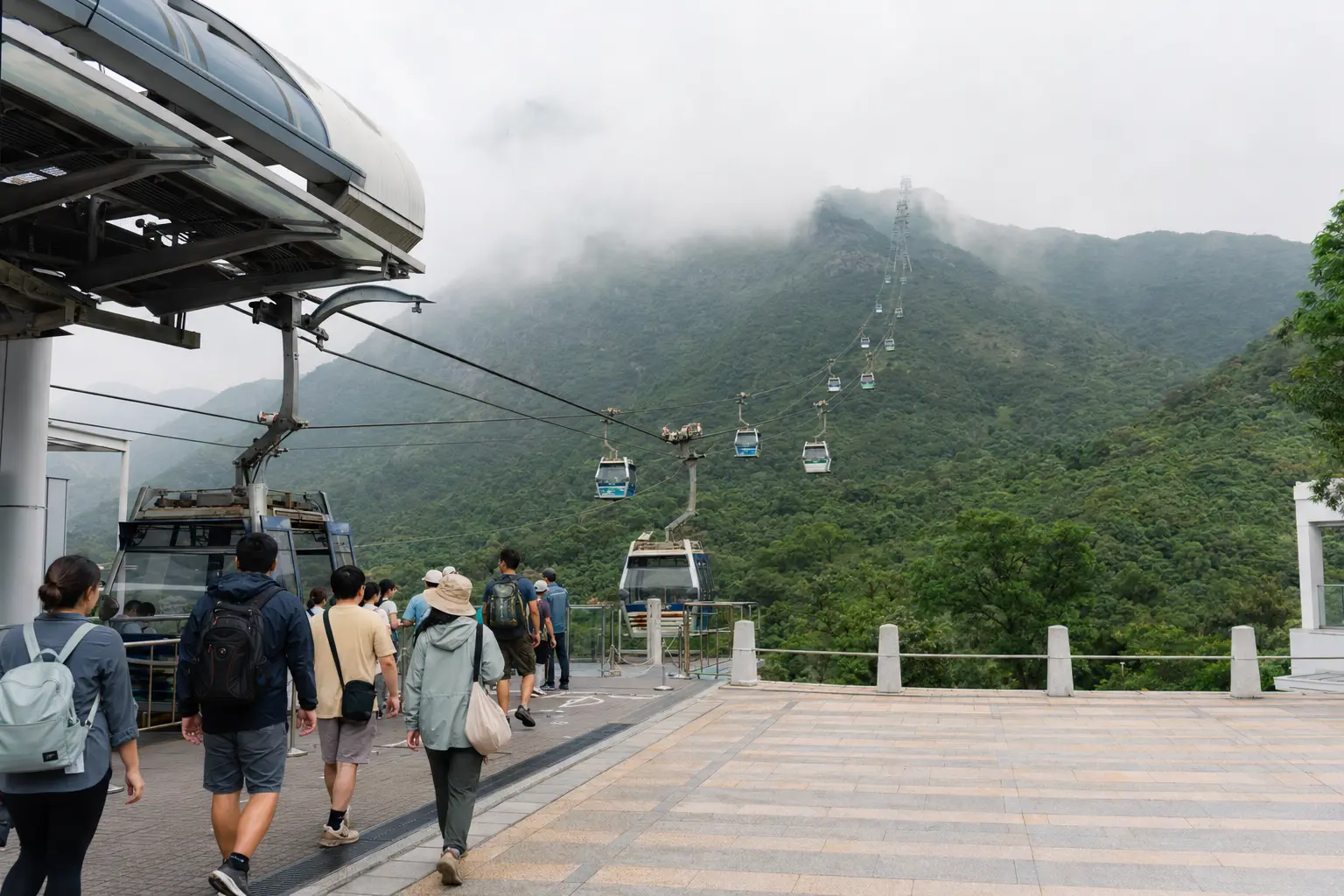 Visitors boarding the Ngong Ping cable car for a misty Lantau day trip