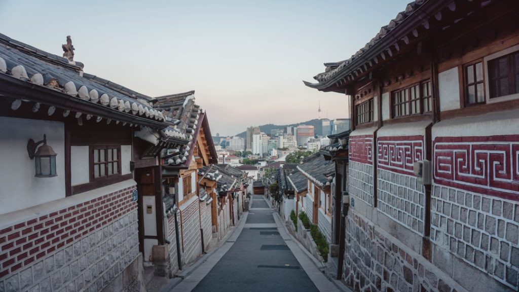 Quiet residential street between traditional houses