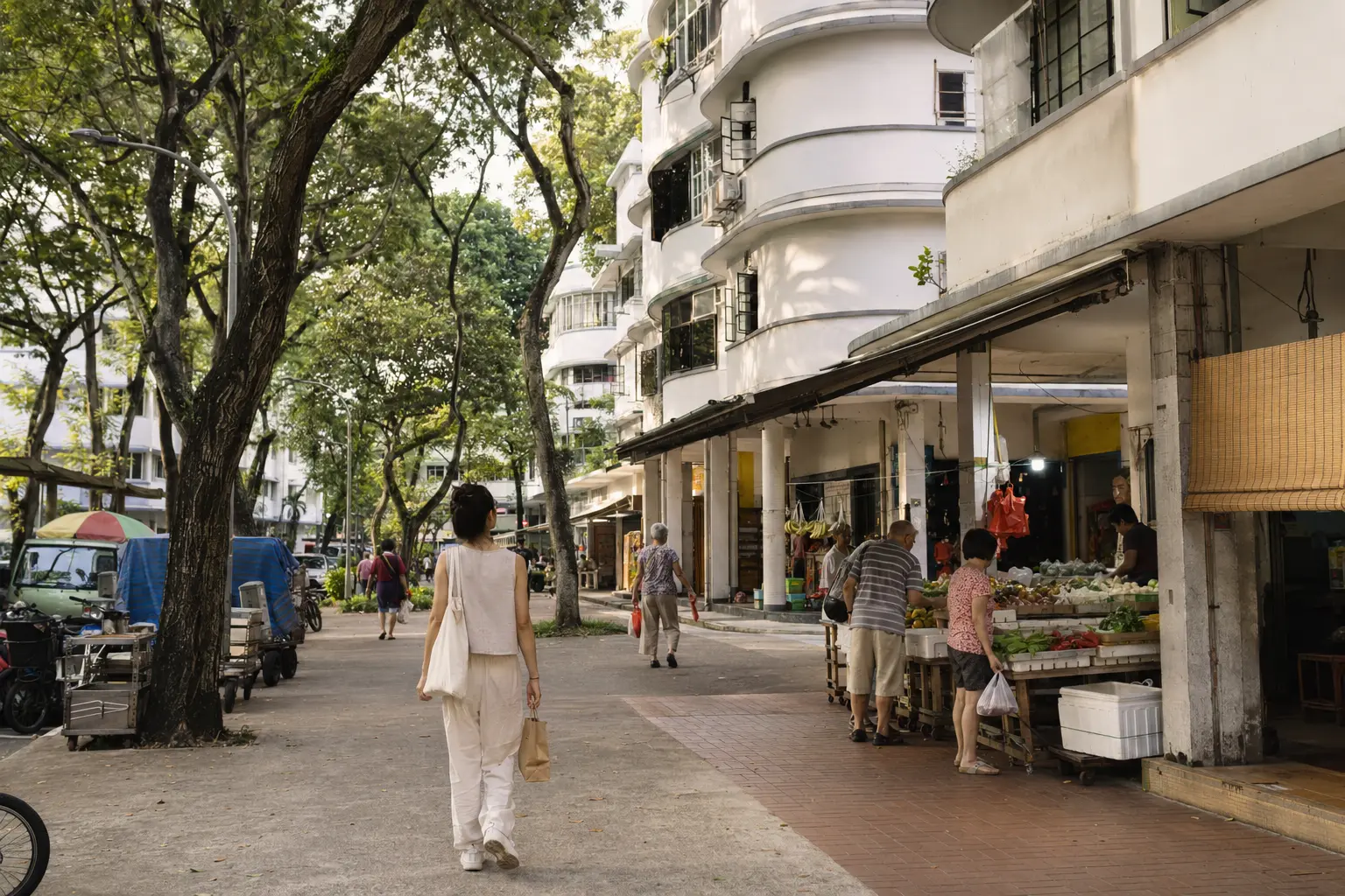Traveler walking past Tiong Bahru housing and morning market stalls