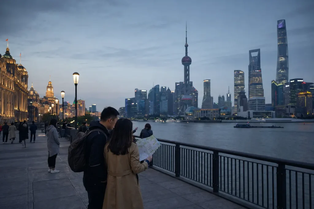 Travelers planning things to do in Shanghai from the Bund at blue hour