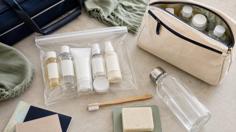 Clear airport liquids bag filled with travel-size toiletry bottles
