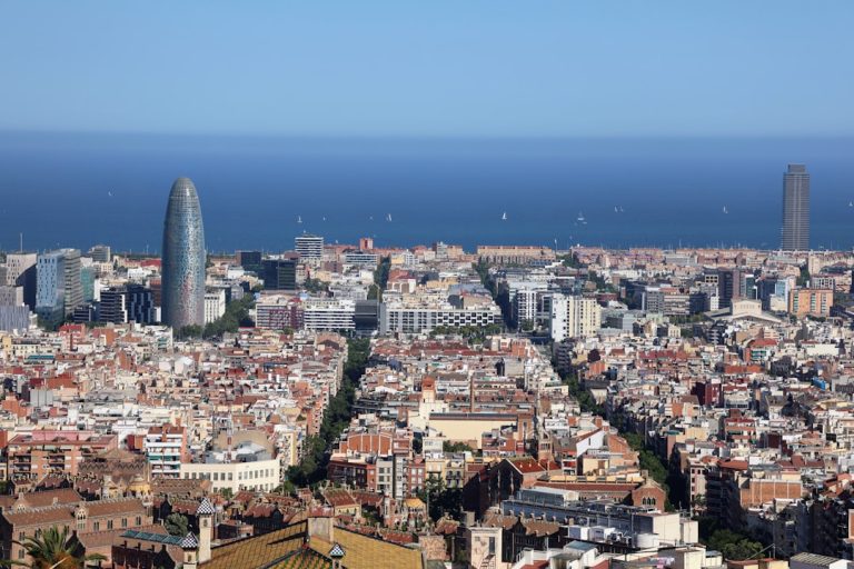 Barcelona cityscape with modern towers and the mediterranean sea — costa rica digital nomad visa