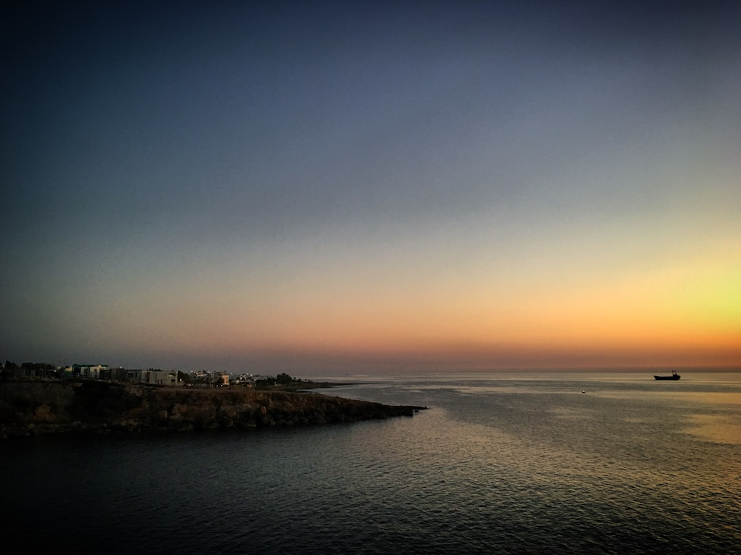 Sunset over the Mediterranean Sea with distant ship and coastline near Paphos, Cyprus, November 2018 — Cyprus Digital Nomad Visa: Requirements & How to Apply
