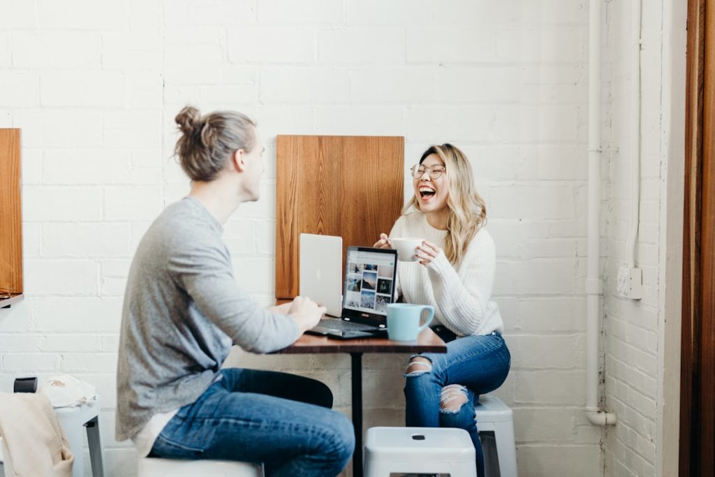 couple sitting on the dining table — digital nomad jobs