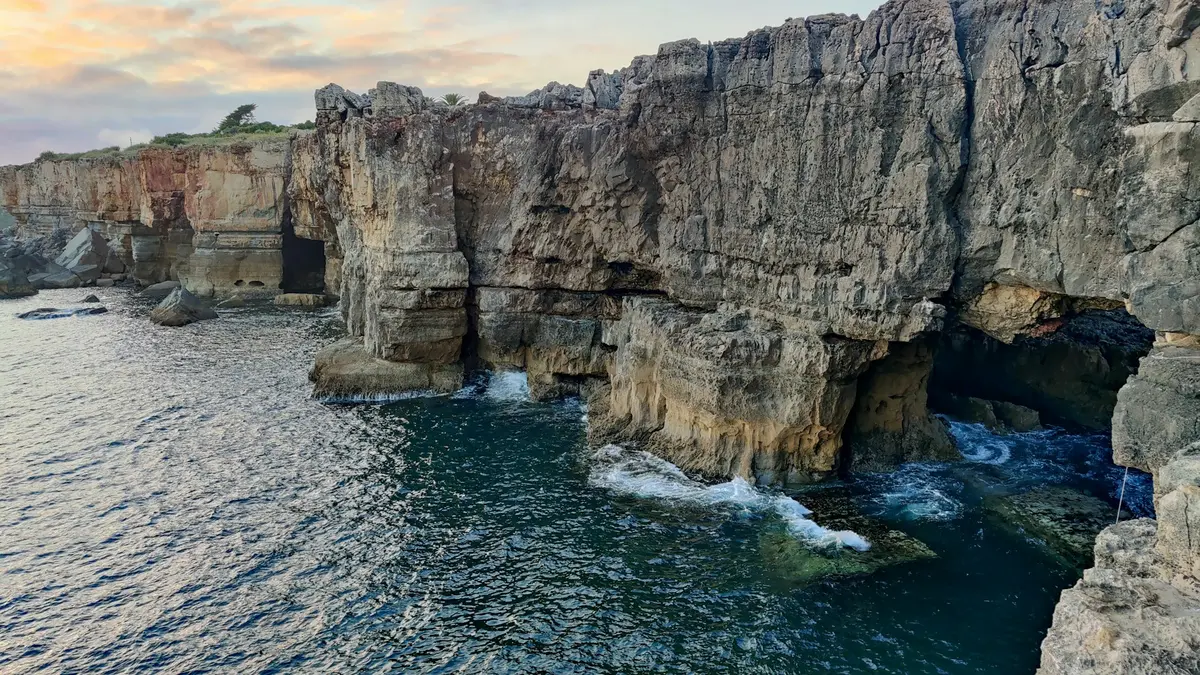 Rock arches and ocean water at Boca do Inferno in Cascais