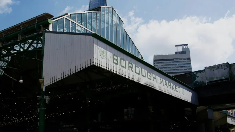 Borough Market building and food stalls beneath modern London architecture
