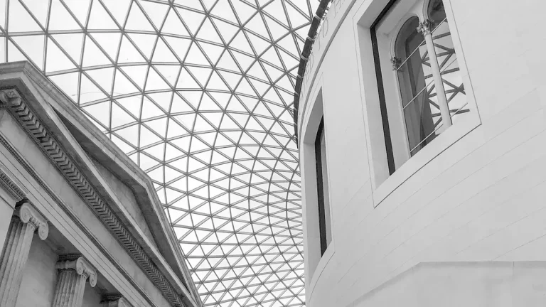 Glass grid roof and classical architecture inside the British Museum Great Court in London