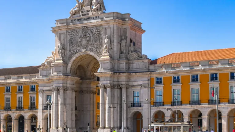 Rua Augusta Arch and yellow arcades at Praça do Comércio in Lisbon