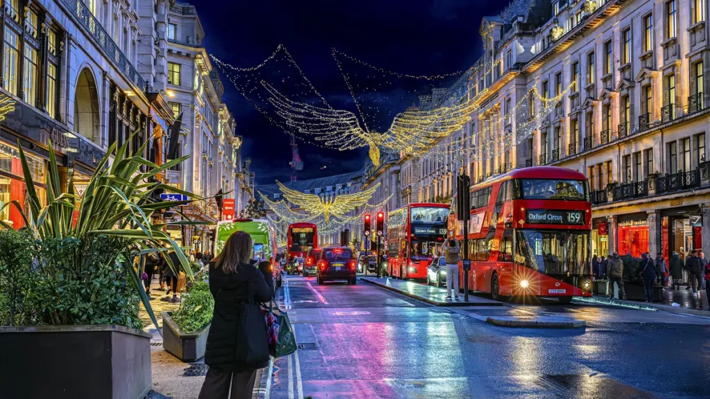 A London street illuminated with colorful Christmas lights at night