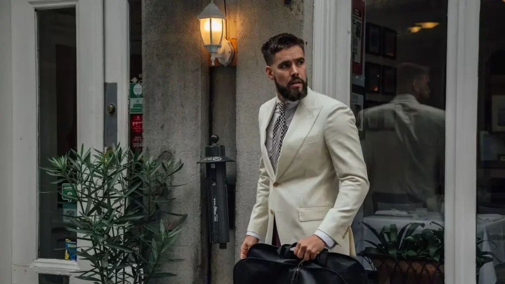Traveler carrying a garment bag for a suit