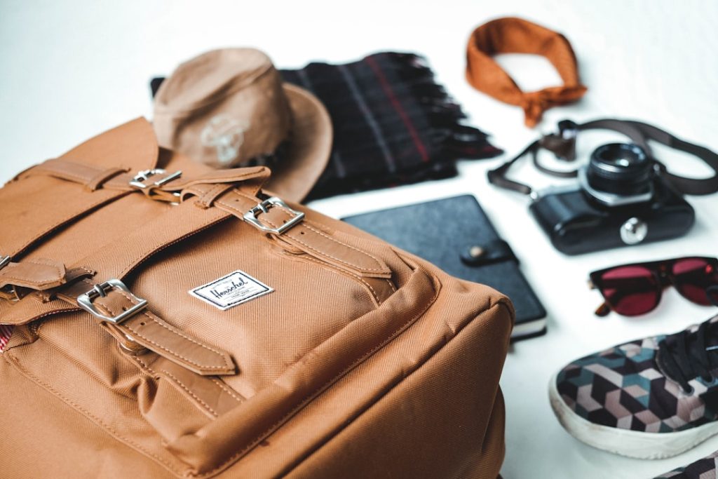 Leather travel bag with shoes and sunglasses
