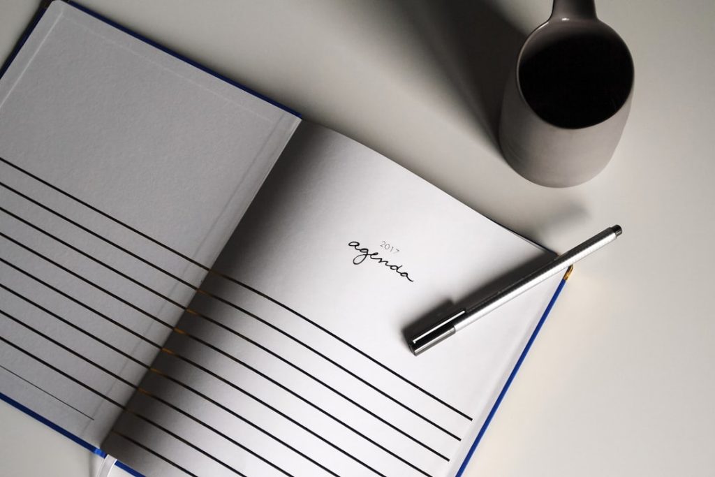 Open notebook and pen for reflective journaling