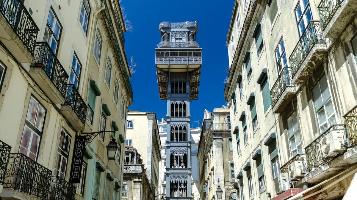Santa Justa Lift rising between historic buildings in central Lisbon