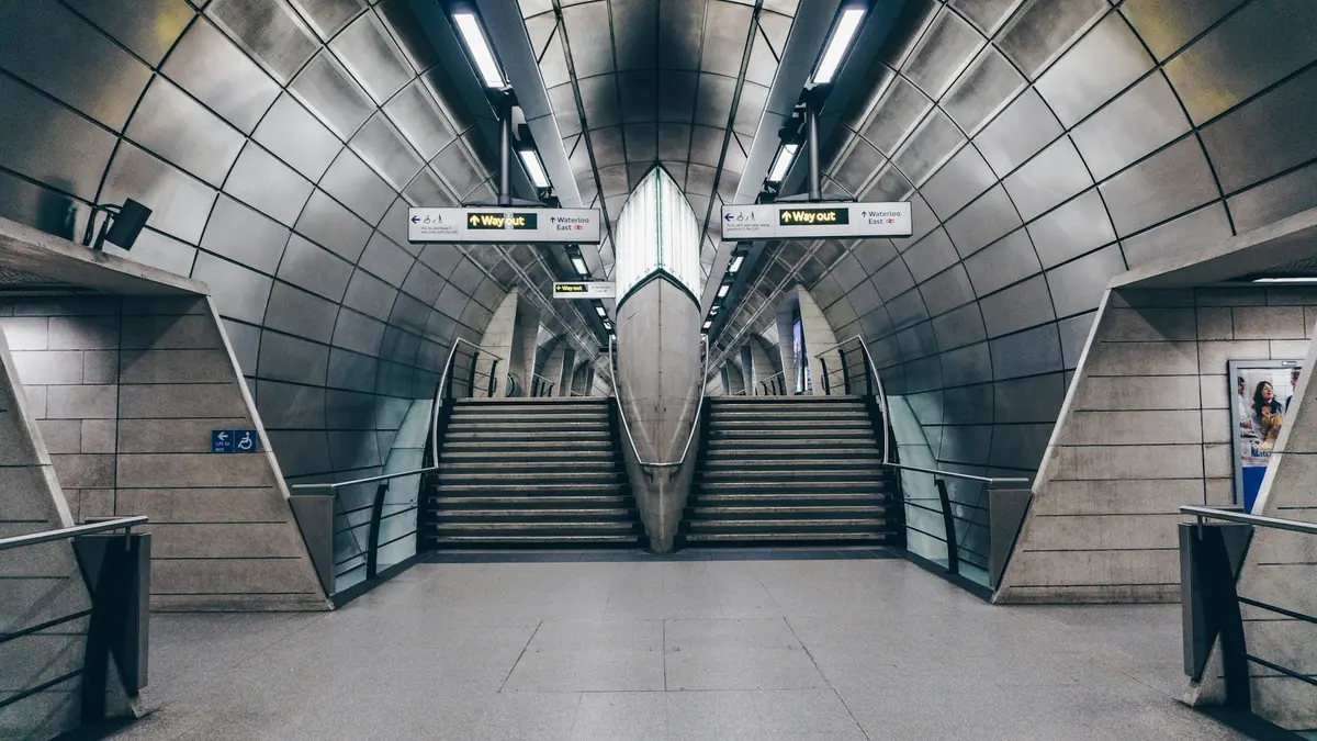 Twin stairways and Way out signs inside Southwark Underground station