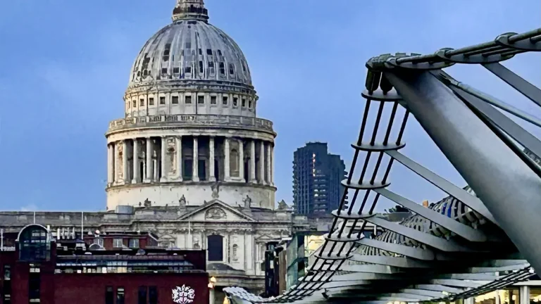St Paul's Cathedral seen across the Thames beside Millennium Bridge in winter evening light