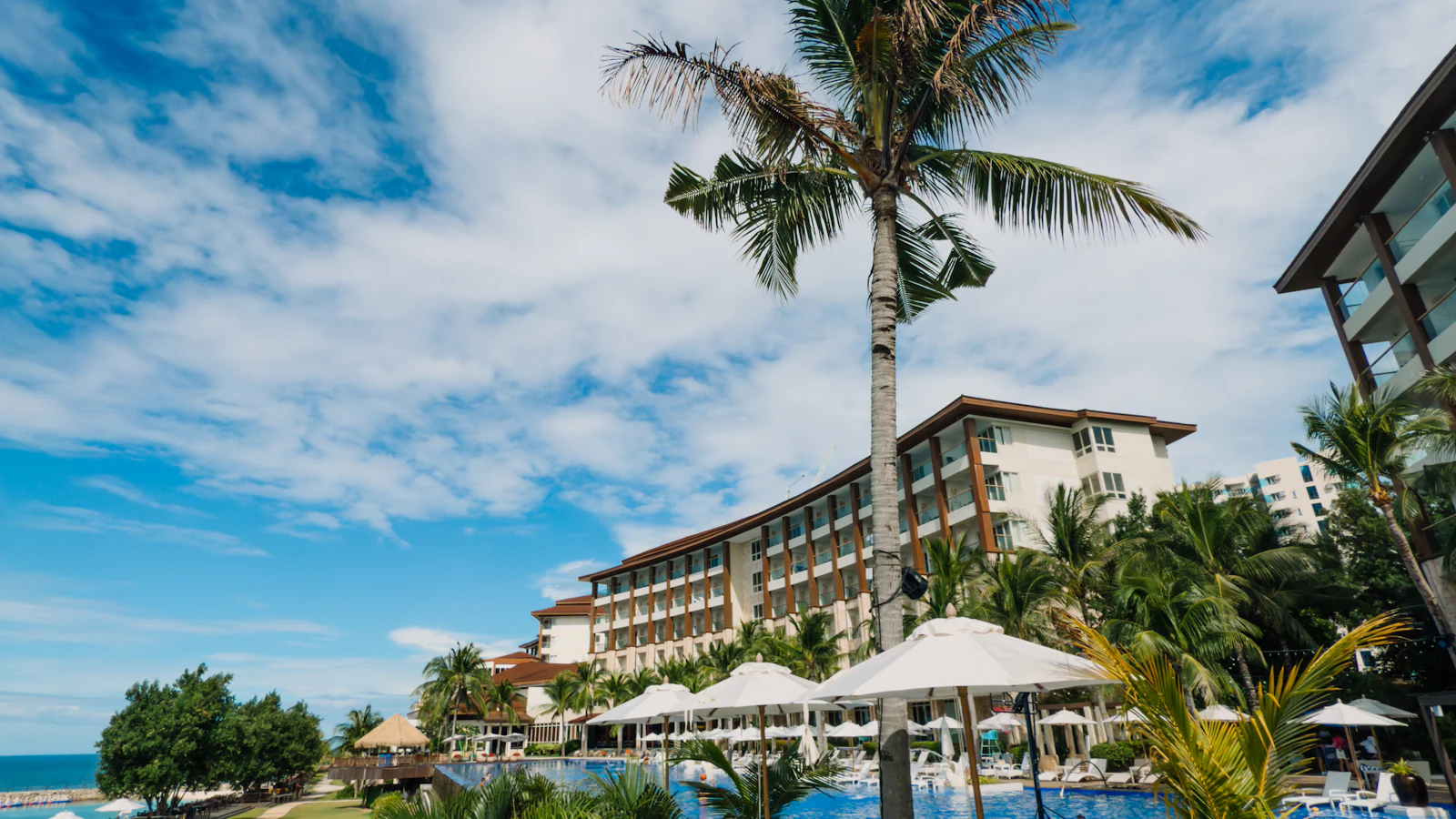 Palm trees and pool at a tropical all-inclusive resort