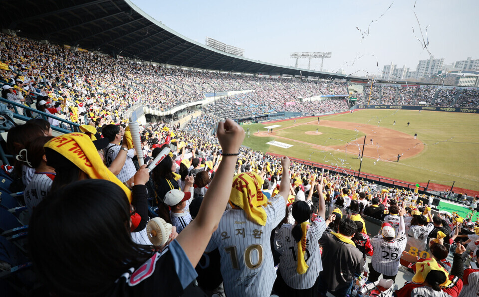 Fans cheering at a baseball game in Seoul