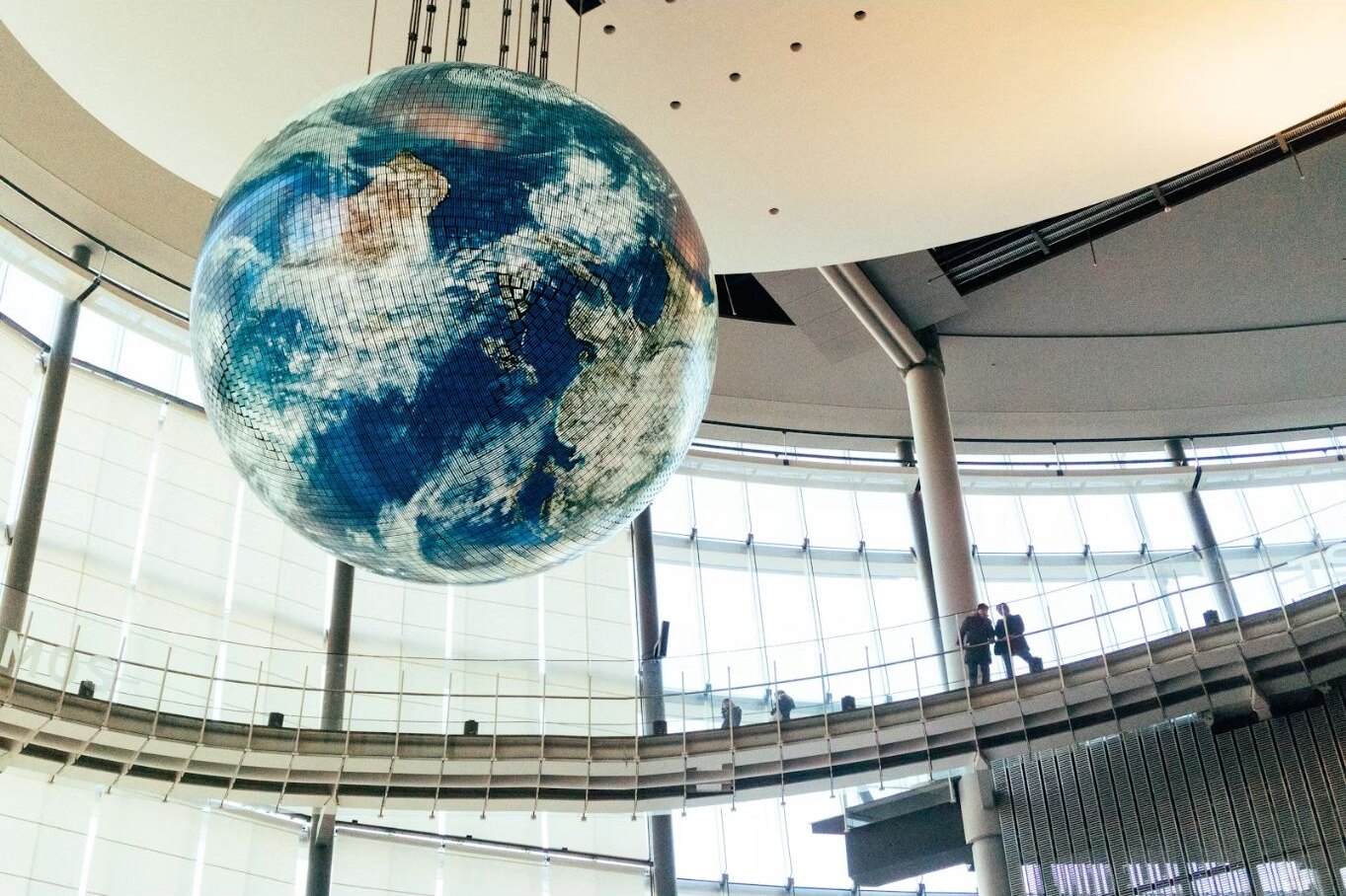 A suspended globe inside a Tokyo museum gallery